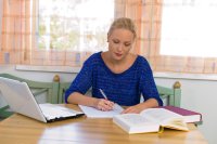 Female student at home doing online coursework