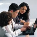 Business people around a computer