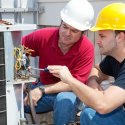 HVAC Technicians working on an A/C unit