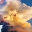 Woman with head in the clouds