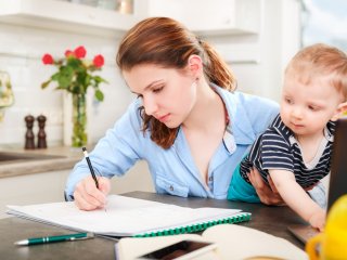 Adult female student with baby on lap 