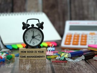 Image of a desk with an alarm clock